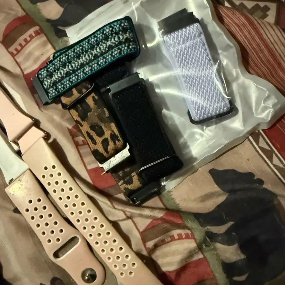 Pair of Fitbit Versa and Fitbit Versa 2, 2 chargers, 2 screen protectors, bands